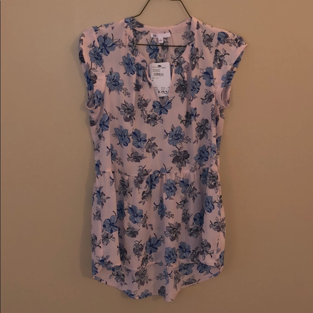 Long tunic blouse with peplum flowy bottom.